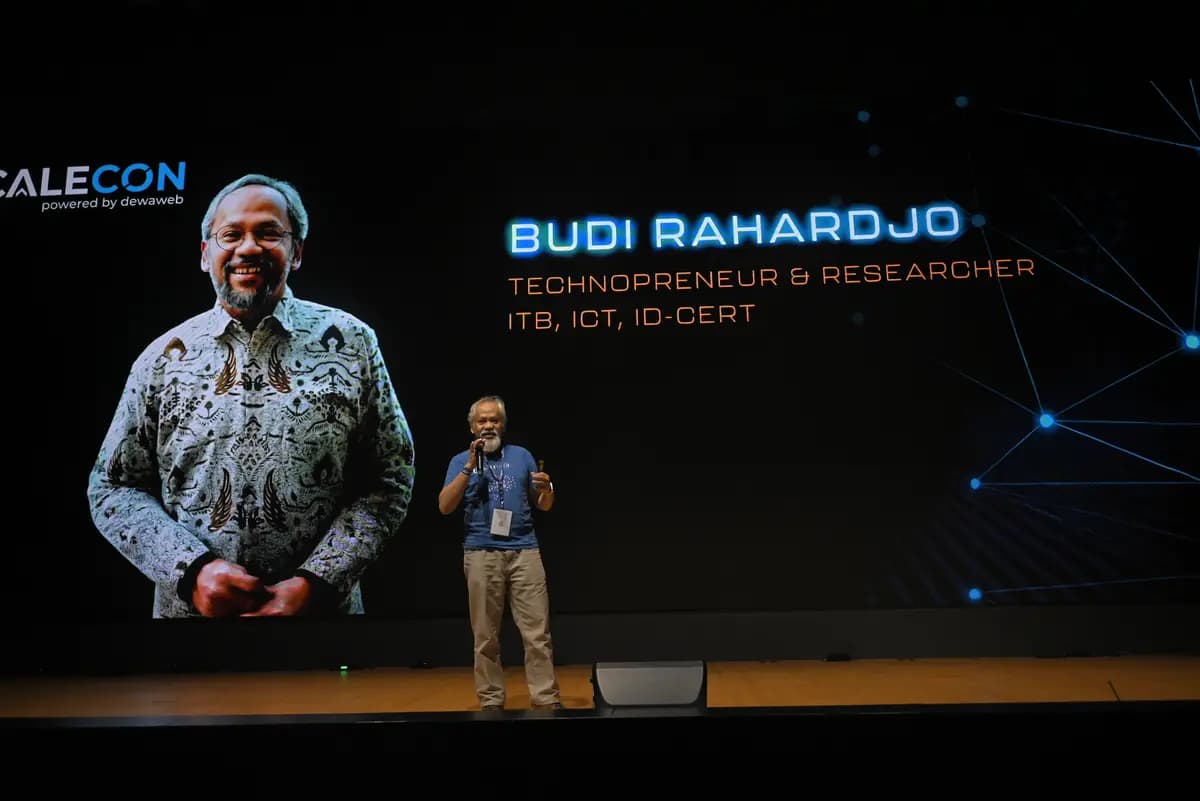A speaker opening their session in front of their introduction slide at SCALECON Surabaya 2026