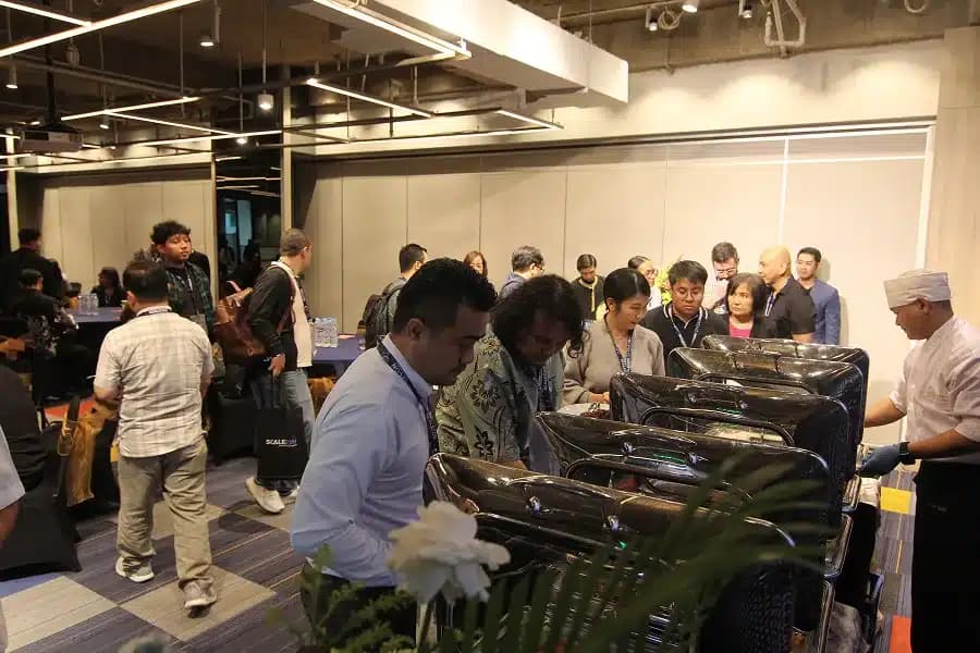 Attendees along the buffet line at a previous SCALECON